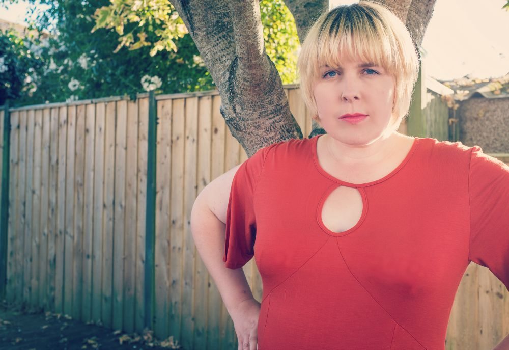 top of orange dress